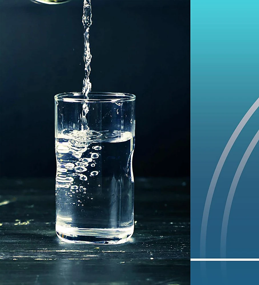 Clear drinking water being poured into a glass