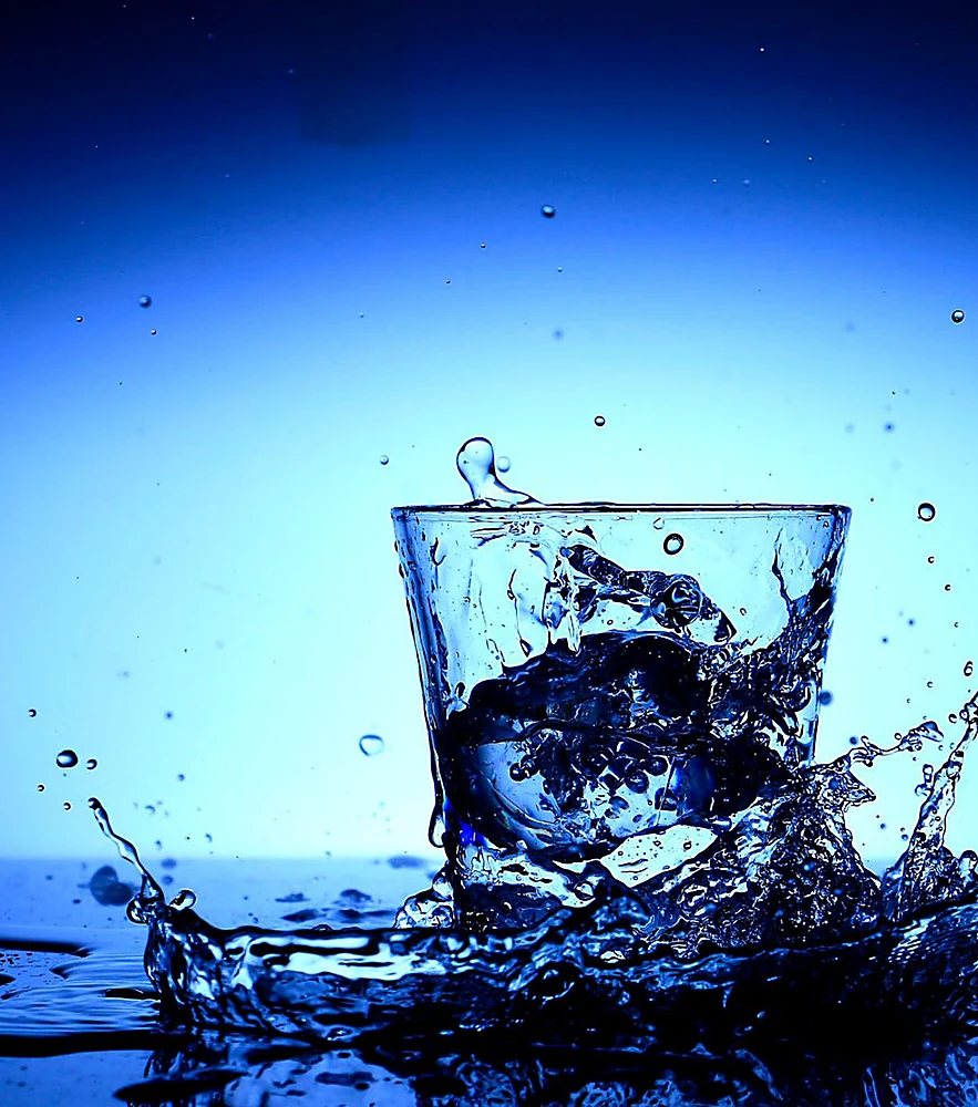 Water splashing into a glass